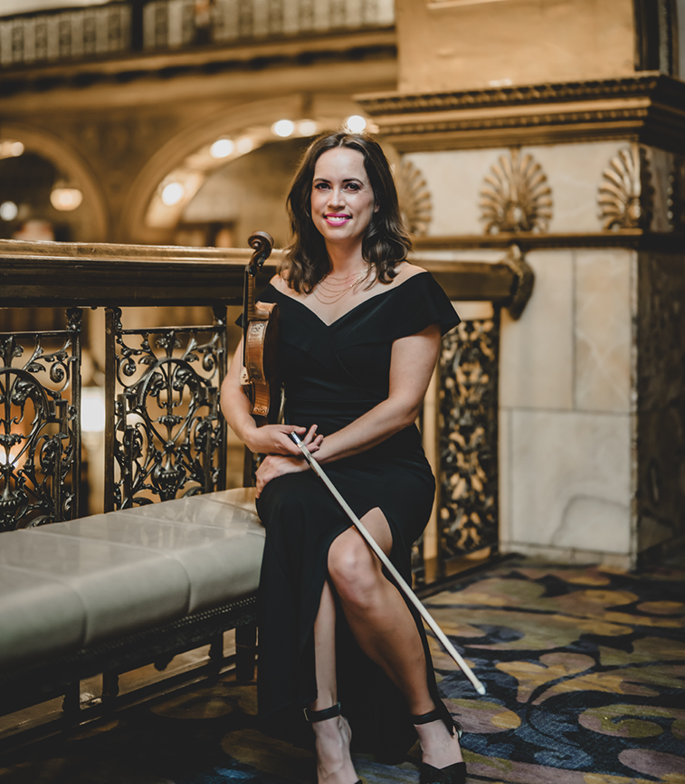 Denver violinist Lannie Shelton seated with violin